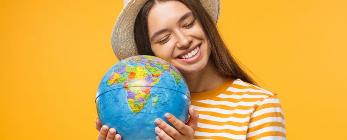 Young women holding a globe