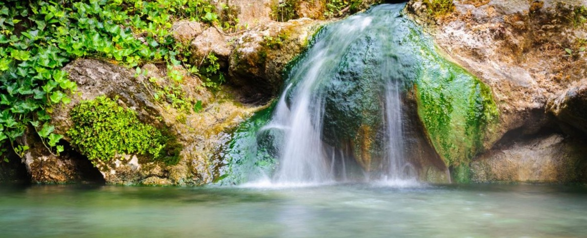 View of hot springs with waterfall