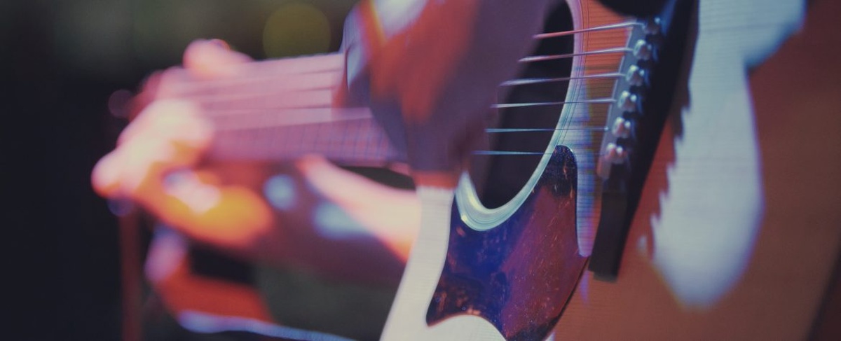 Guitarist in night club - musician plays blues acoustic guitar, extremely close up at The Santa Barbara Bowl.