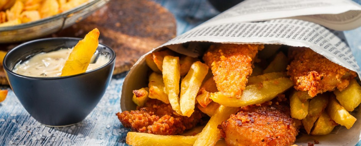 Closeup of Fish and Chips served in a newspaper at the santa barbara harbor festival.