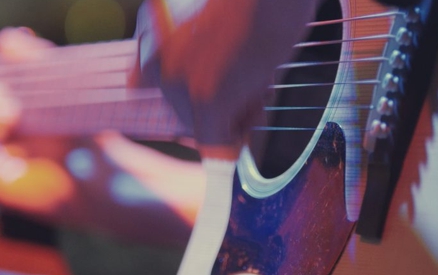 Guitarist in night club - musician plays blues acoustic guitar, extremely close up at The Santa Barbara Bowl.