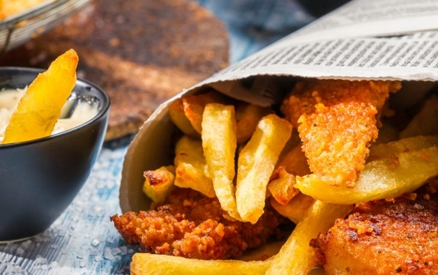 Closeup of Fish and Chips served in a newspaper at the santa barbara harbor festival.