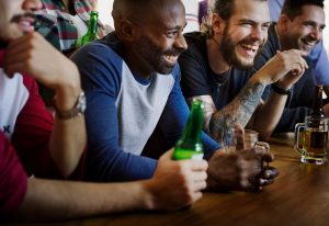 guys drinking at sports bar